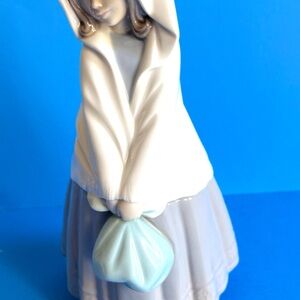 Vintage Nao by Ladro Peasant Girl Wearing A Shawl Holding A Bundle from Spain